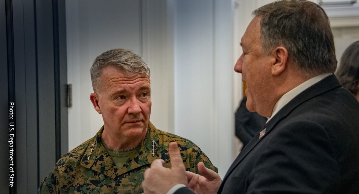 U.S official talk to an army commander